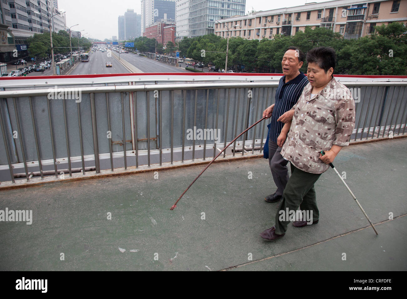 A Blind Couple Walking Arm In Arm Together In Fuchengmen Beijing China Stock Photo Alamy