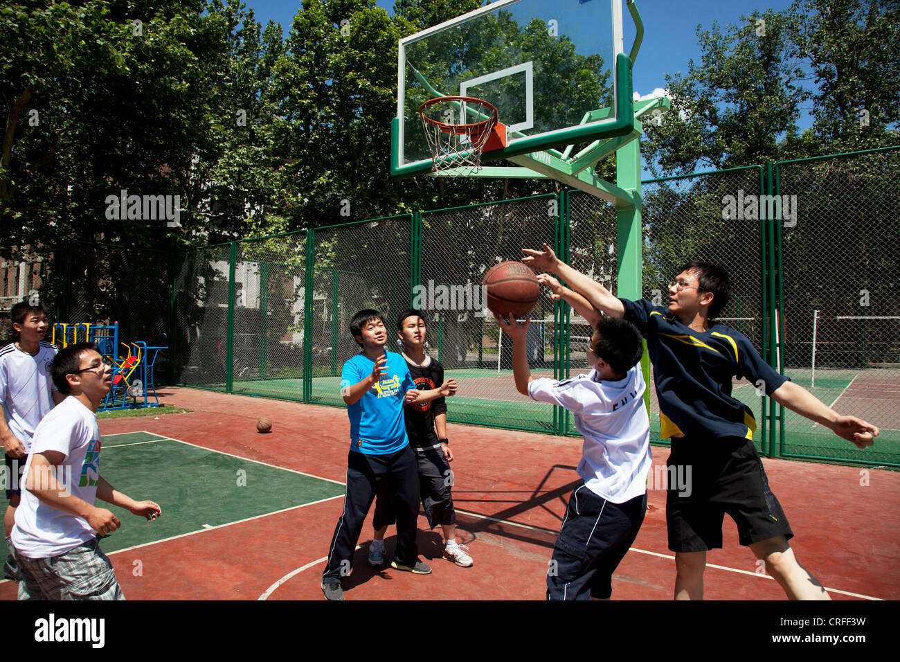 Students playing basketball on campus at Tsinghua University in Beijing