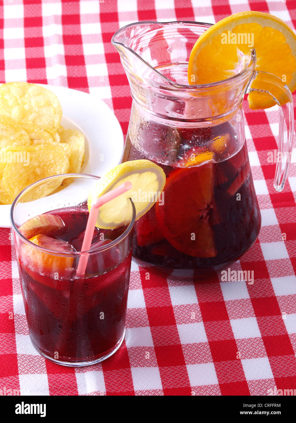 https://c8.alamy.com/comp/CRFFRM/sangria-pitcher-and-a-glass-served-with-chips-CRFFRM.jpg