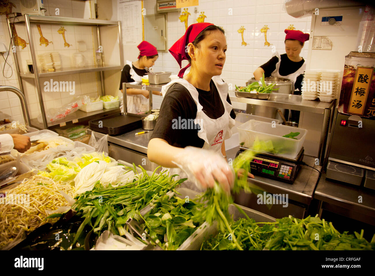 Restaurant workers serving in the canteen food hall of eplaza digital