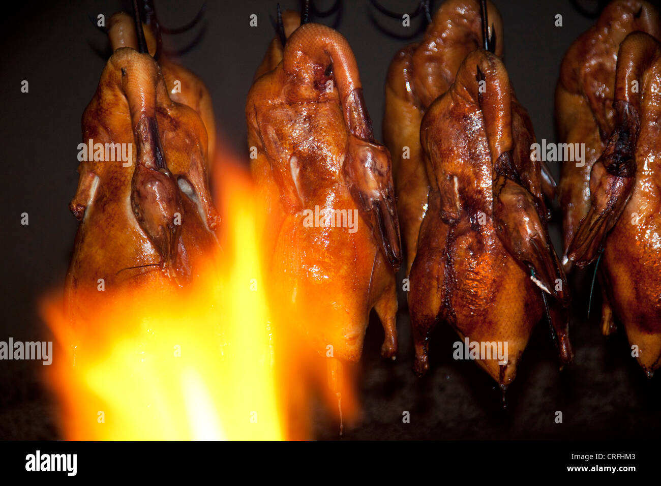 Peking roast duck cooking in an oven in the famous Quanjude duck