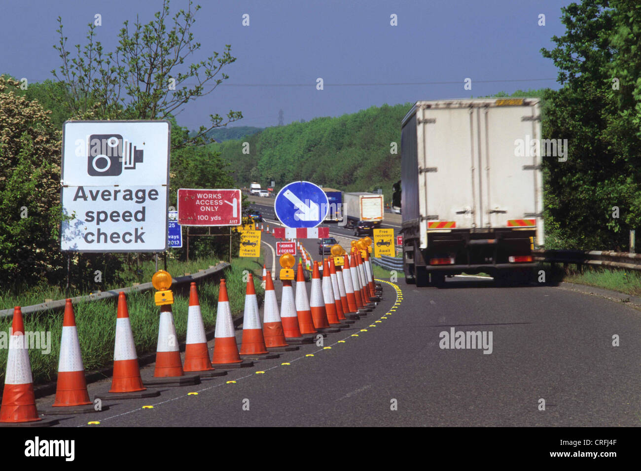 lorry passing warning sign of average speed cameras on the m62 motorway near leeds yorkshire uk Stock Photo