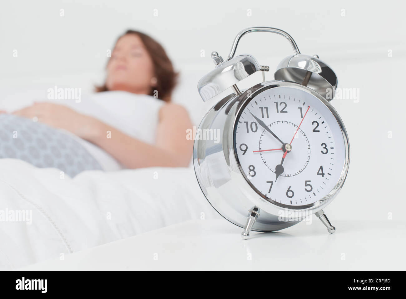 Alarm clock on bedside table Stock Photo Alamy