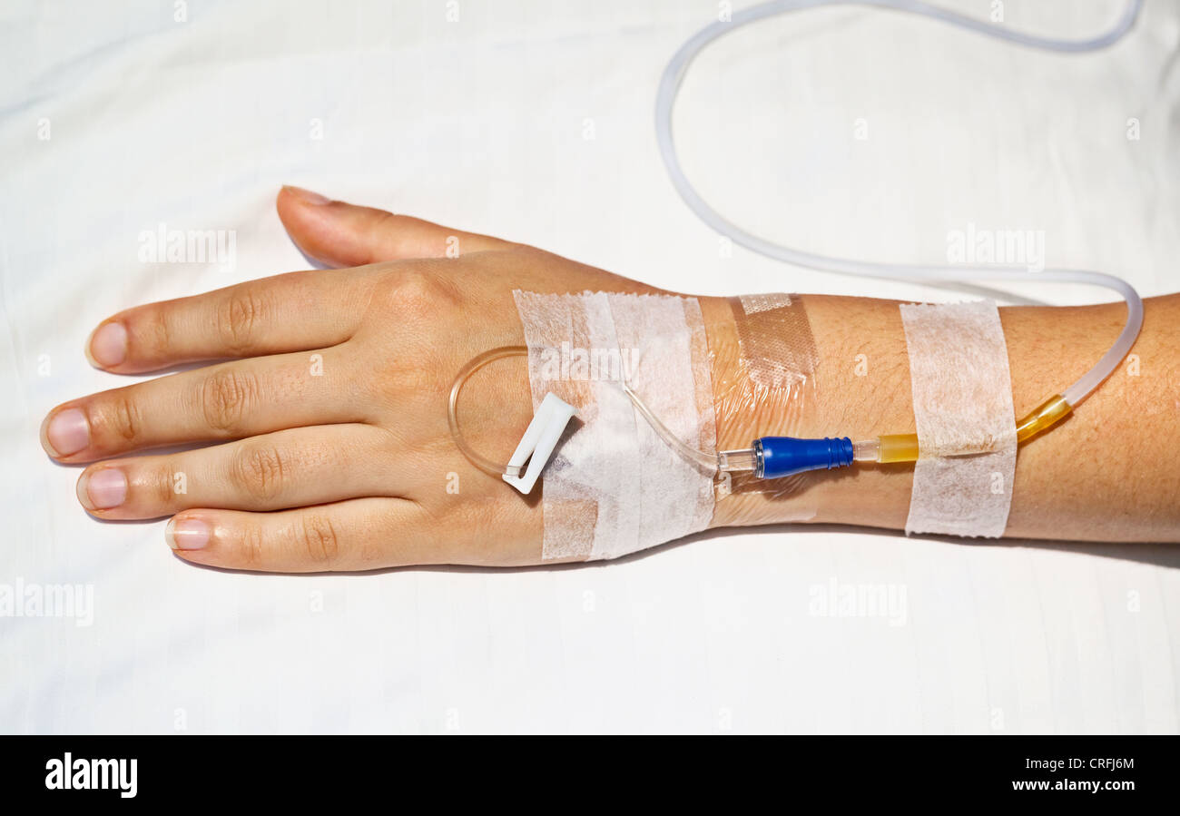Medical intravenous cannula in his hand a sick person Stock Photo