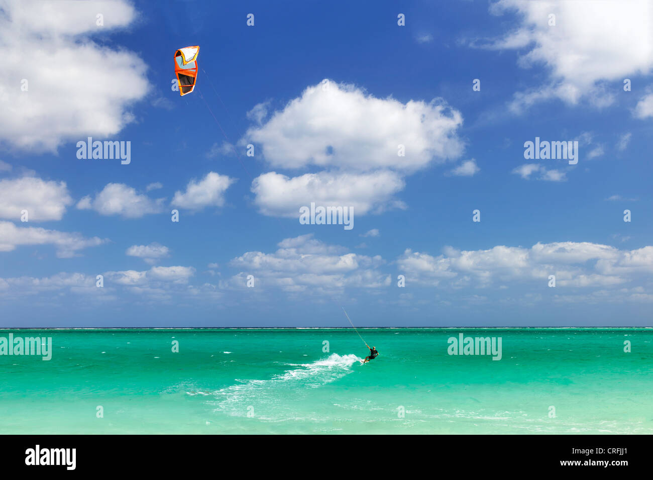 Man kitesurfing,or kiteboarding at Grace Bay. Providenciales. Turks and Caicos Stock Photo