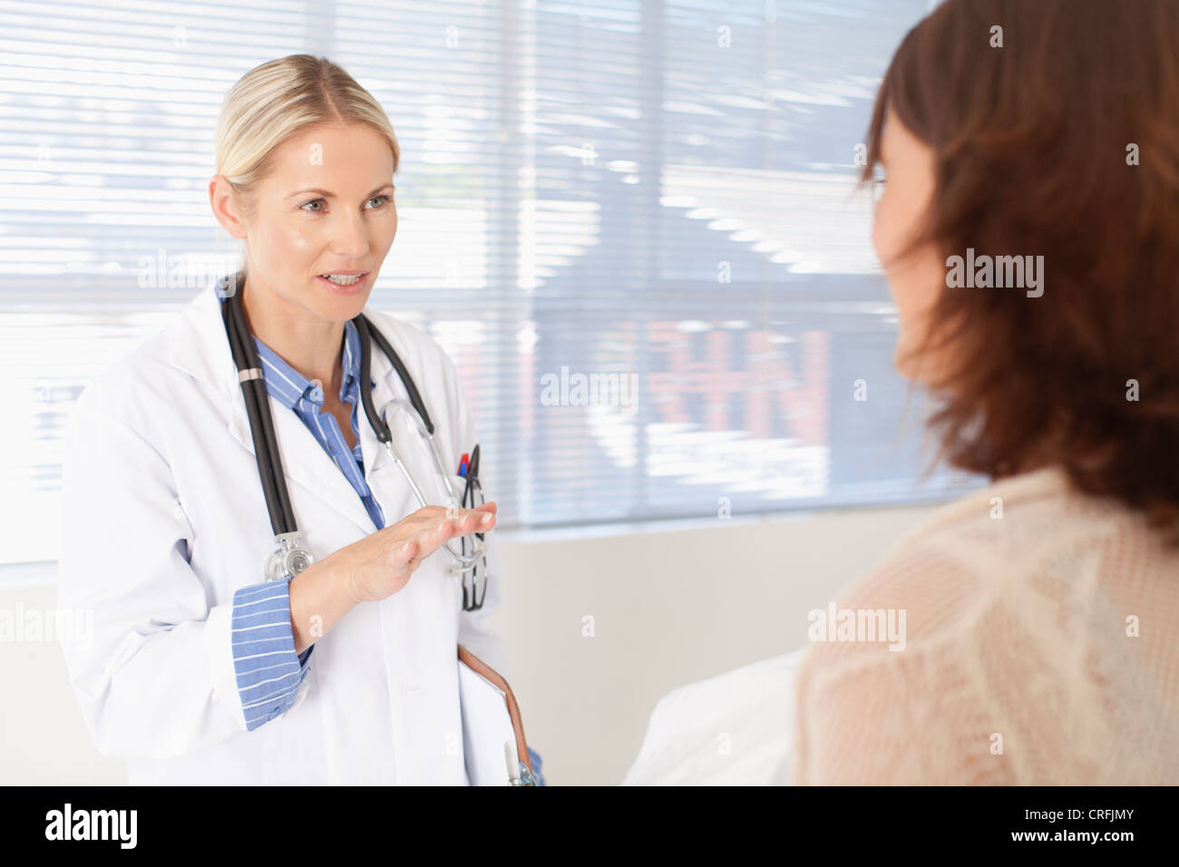 Doctor and patient talking in office Stock Photo