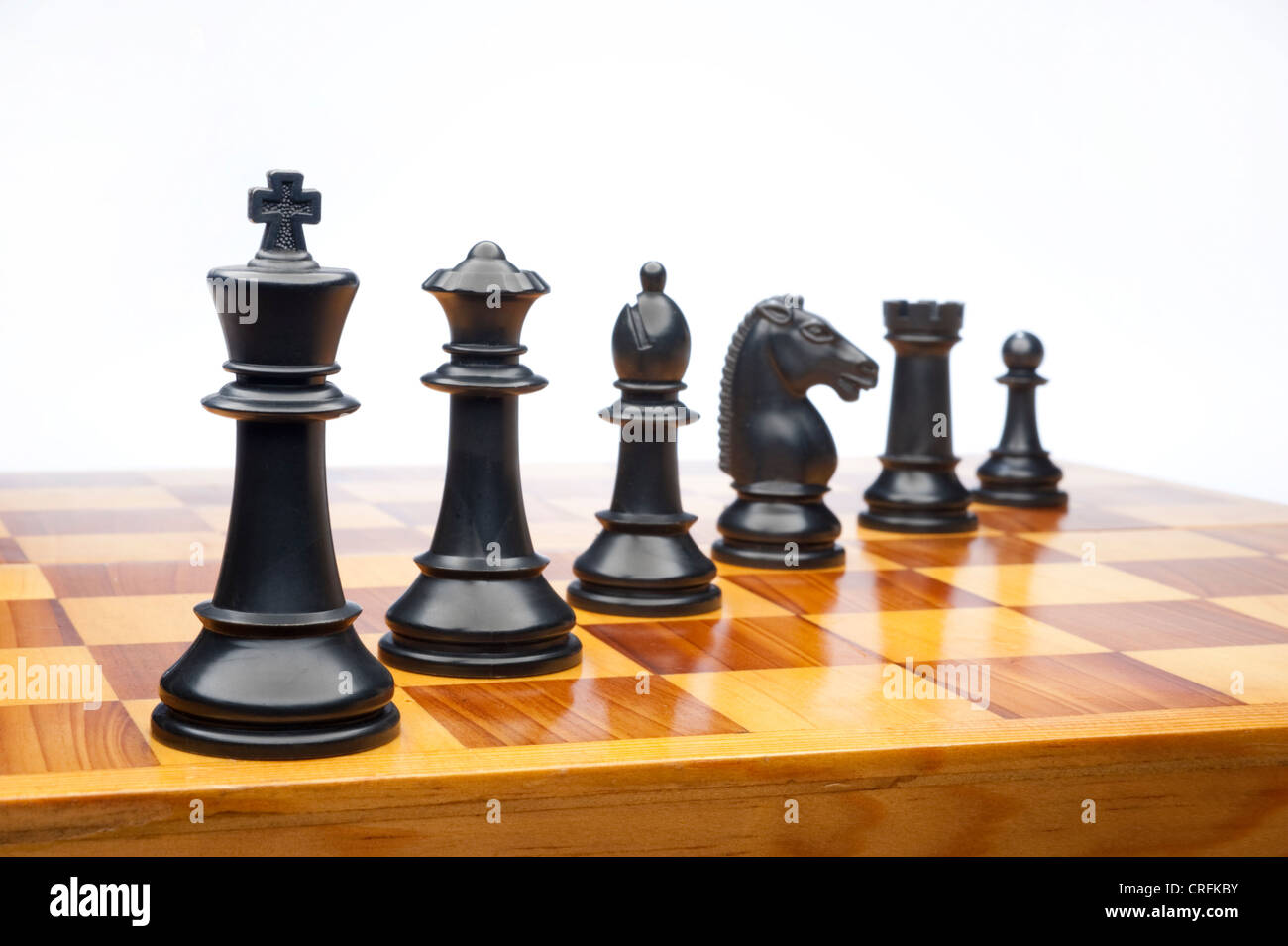 Chess pieces on wood chessboard Stock Photo