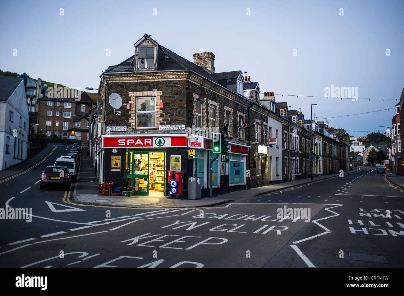 Dusk evening - a Spar convenience store corner shop open in the evening UK Stock Photo