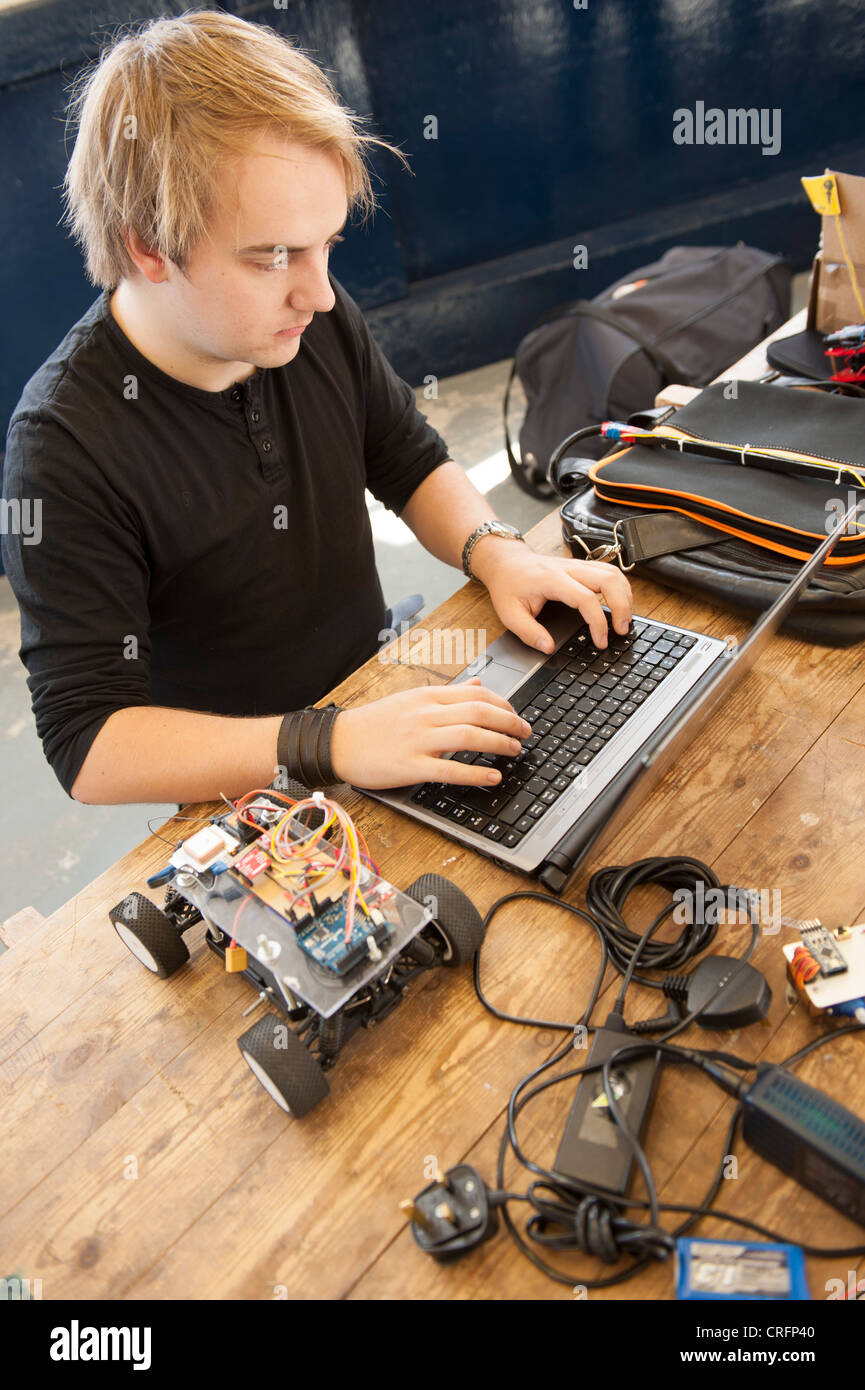 A computer science student at Aberystwyth University programming an autonomous vehicle, UK Stock Photo