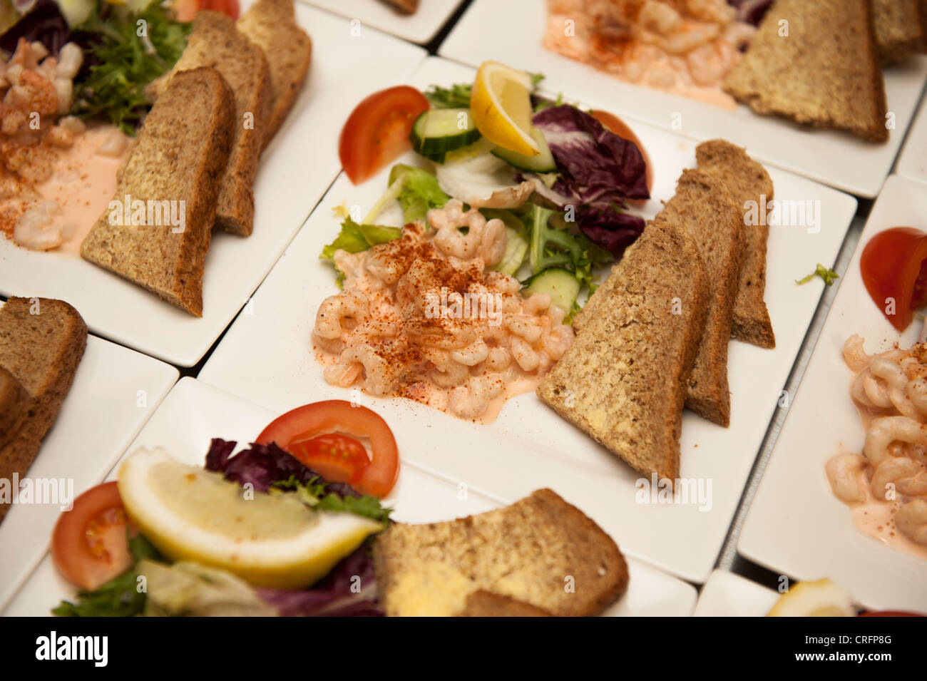 Plates Of Prawn Cocktail With Slices Of Brown Buttered Bread