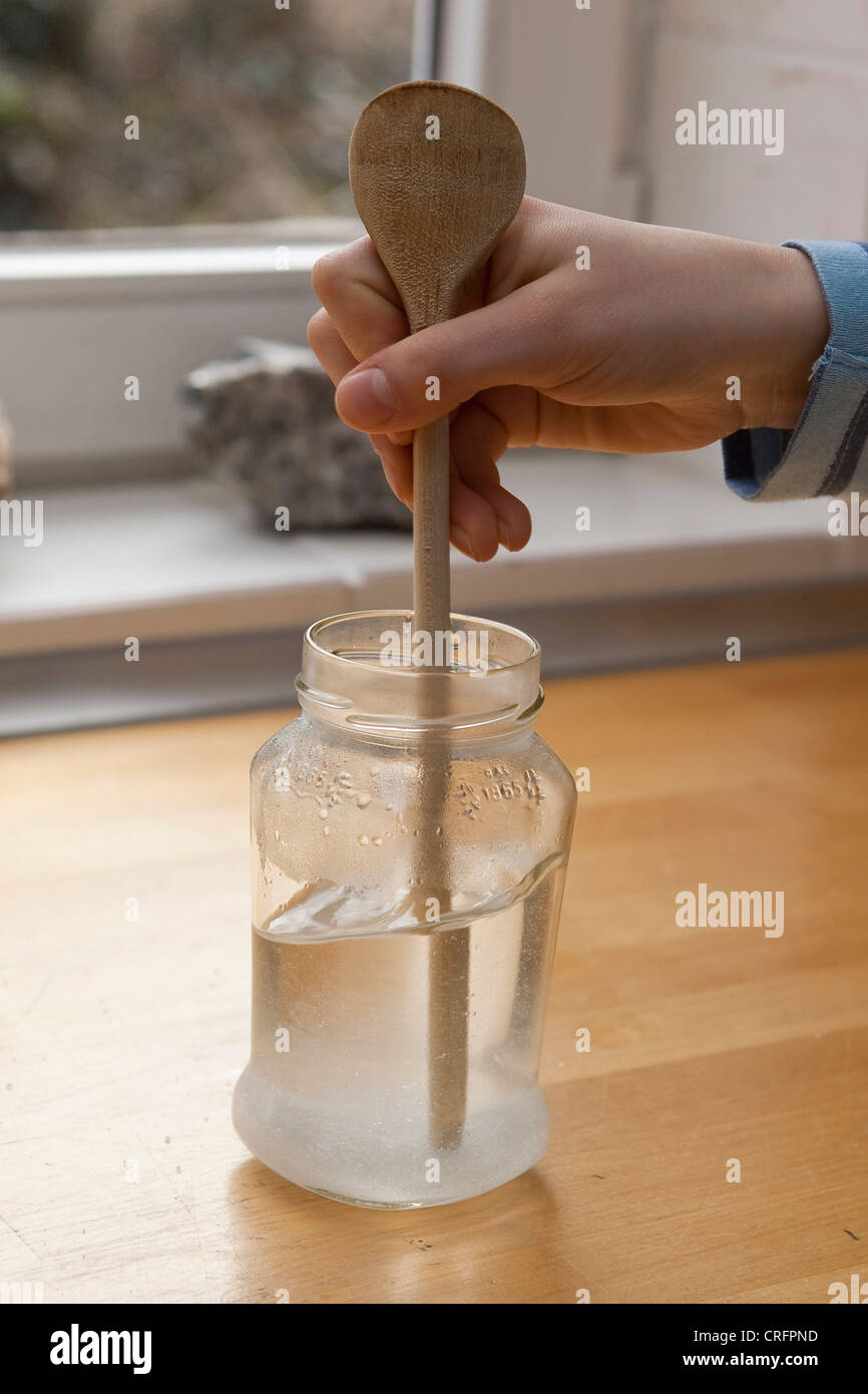 children experimenting and growing crystals. Step 3 water stirring up