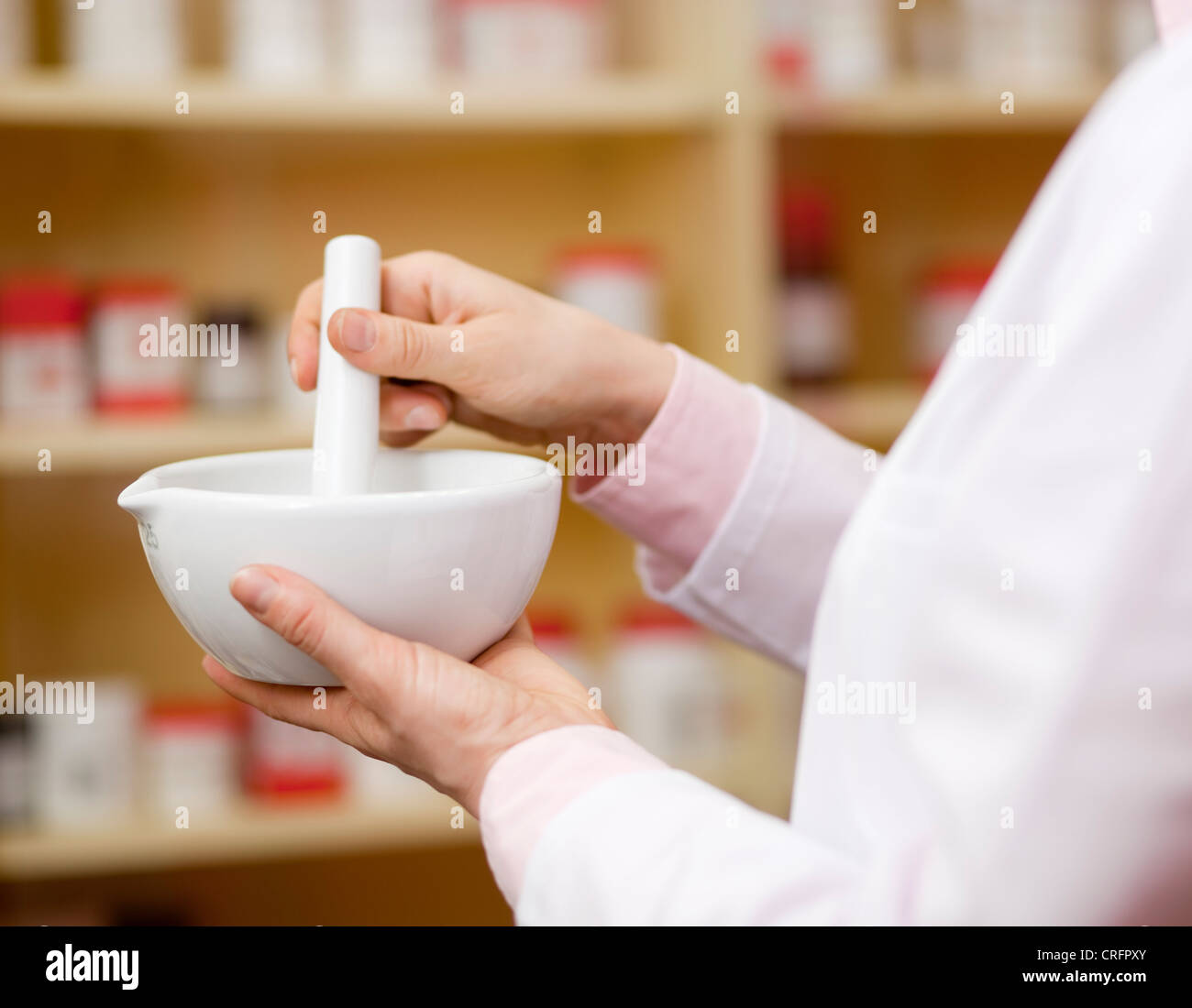 Pharmacist using mortar and pestle Stock Photo Alamy