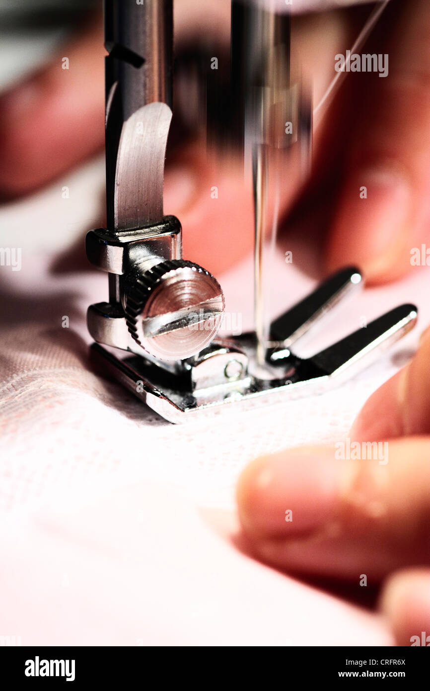 seamstress using sewing machine in their daily work Stock Photo Alamy