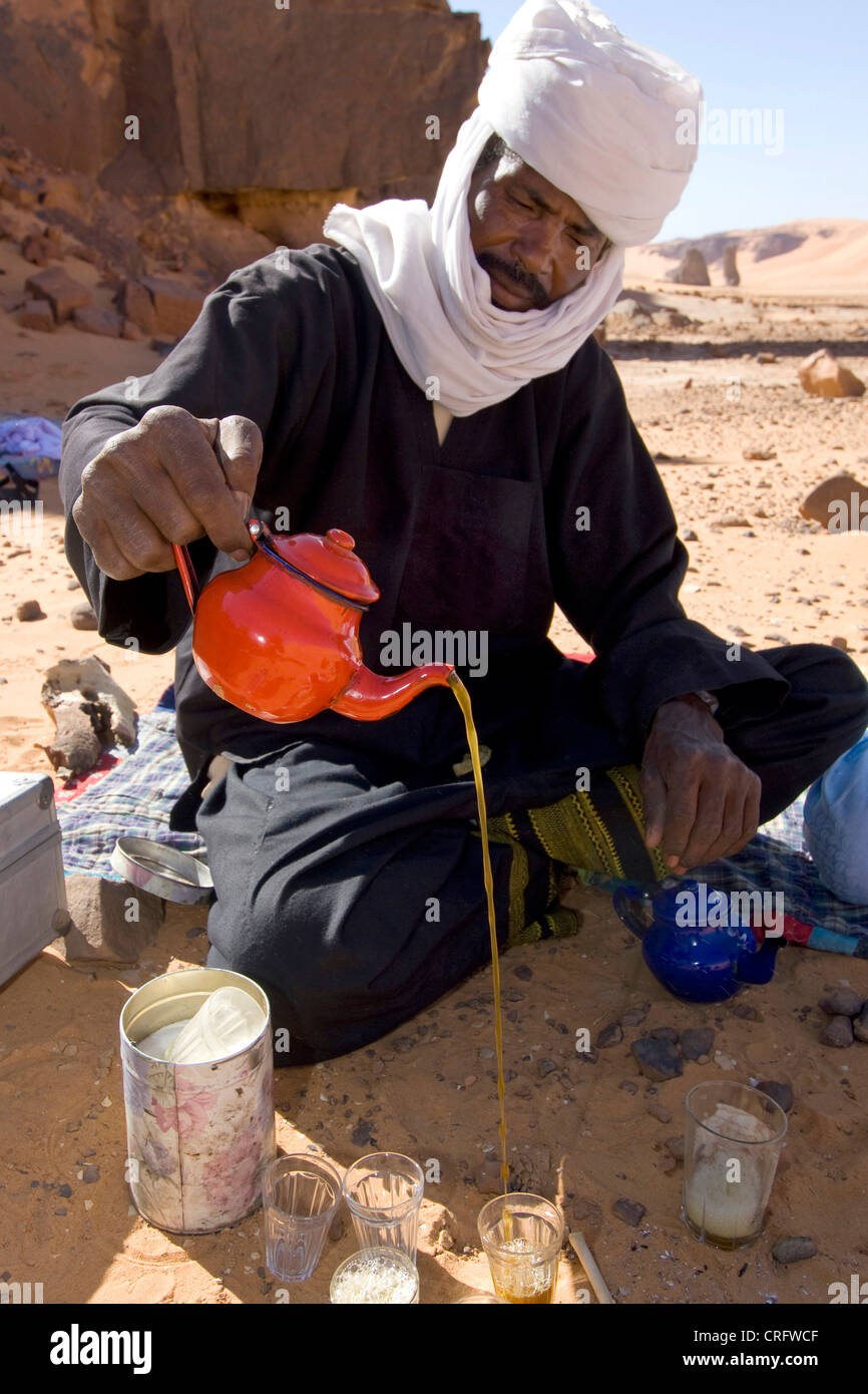 Touareg pouring tea, tea ceremony, Algeria, Sahara Stock Photo Alamy