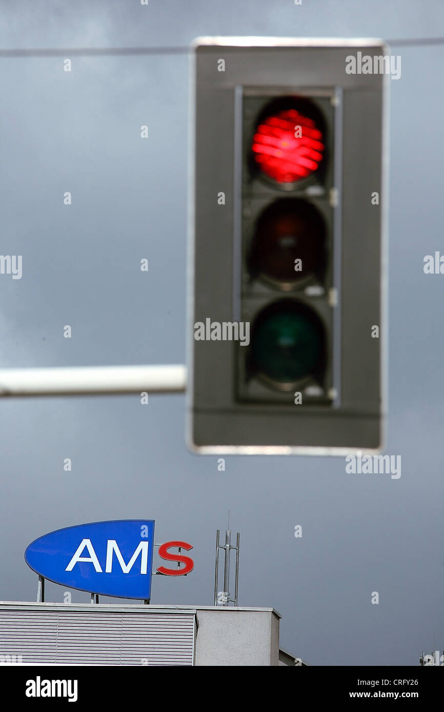 logo of AMS Austria behind  a red traffic light, Austria Stock Photo