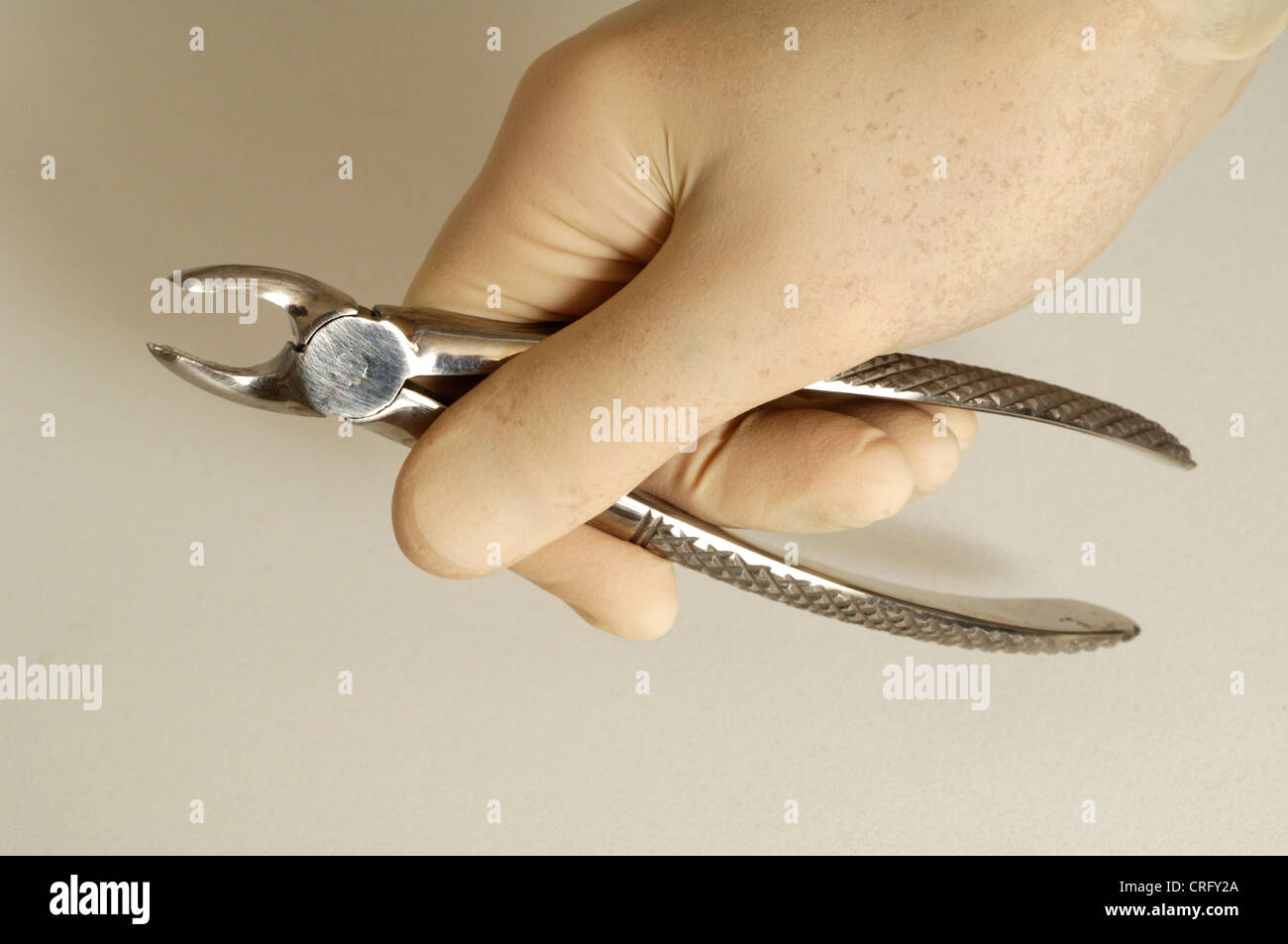 A pair of stainless steel orthodontic pliers used to extract teeth