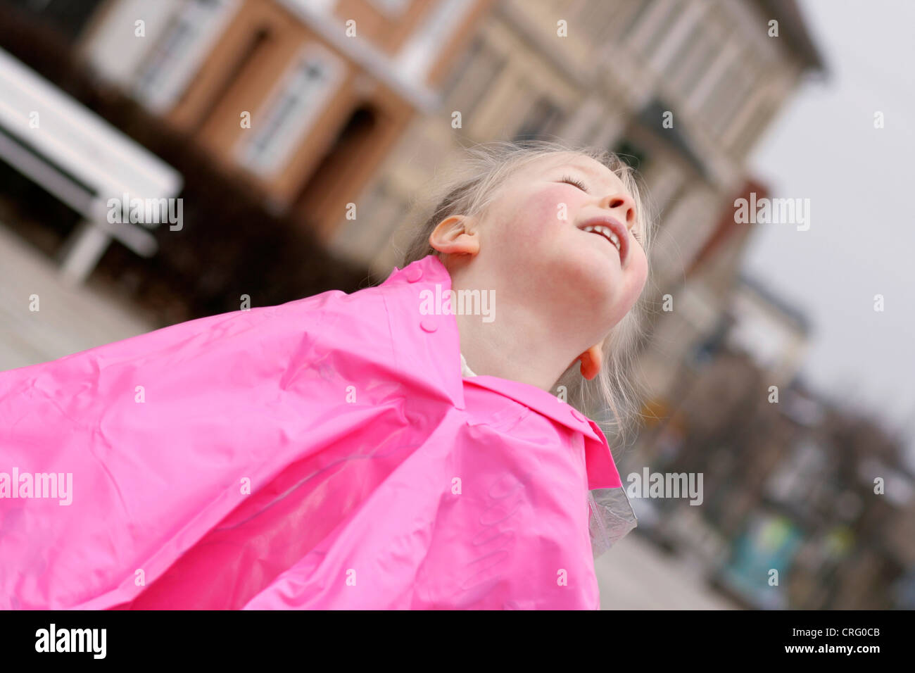 blond girl standing in rain, Germany Stock Photo