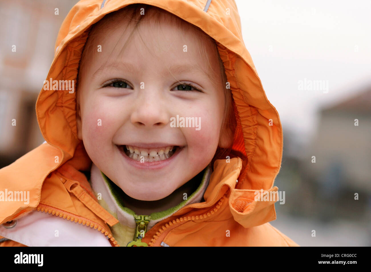 Little girl with hood having fun hires stock photography and images