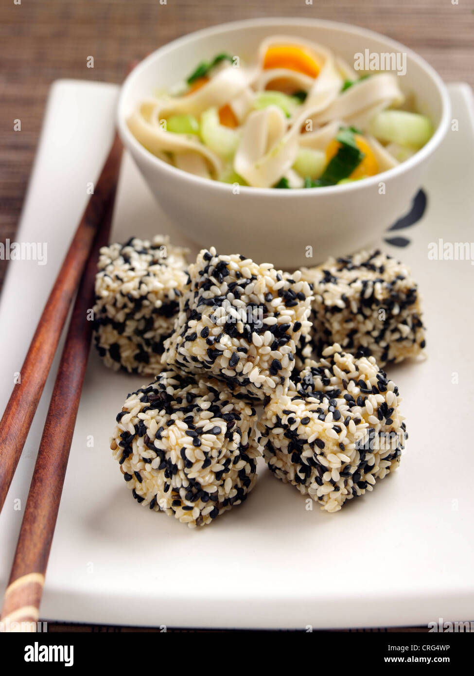 Deep fried tofu with stir fry noodles vegetables Japanese main meal