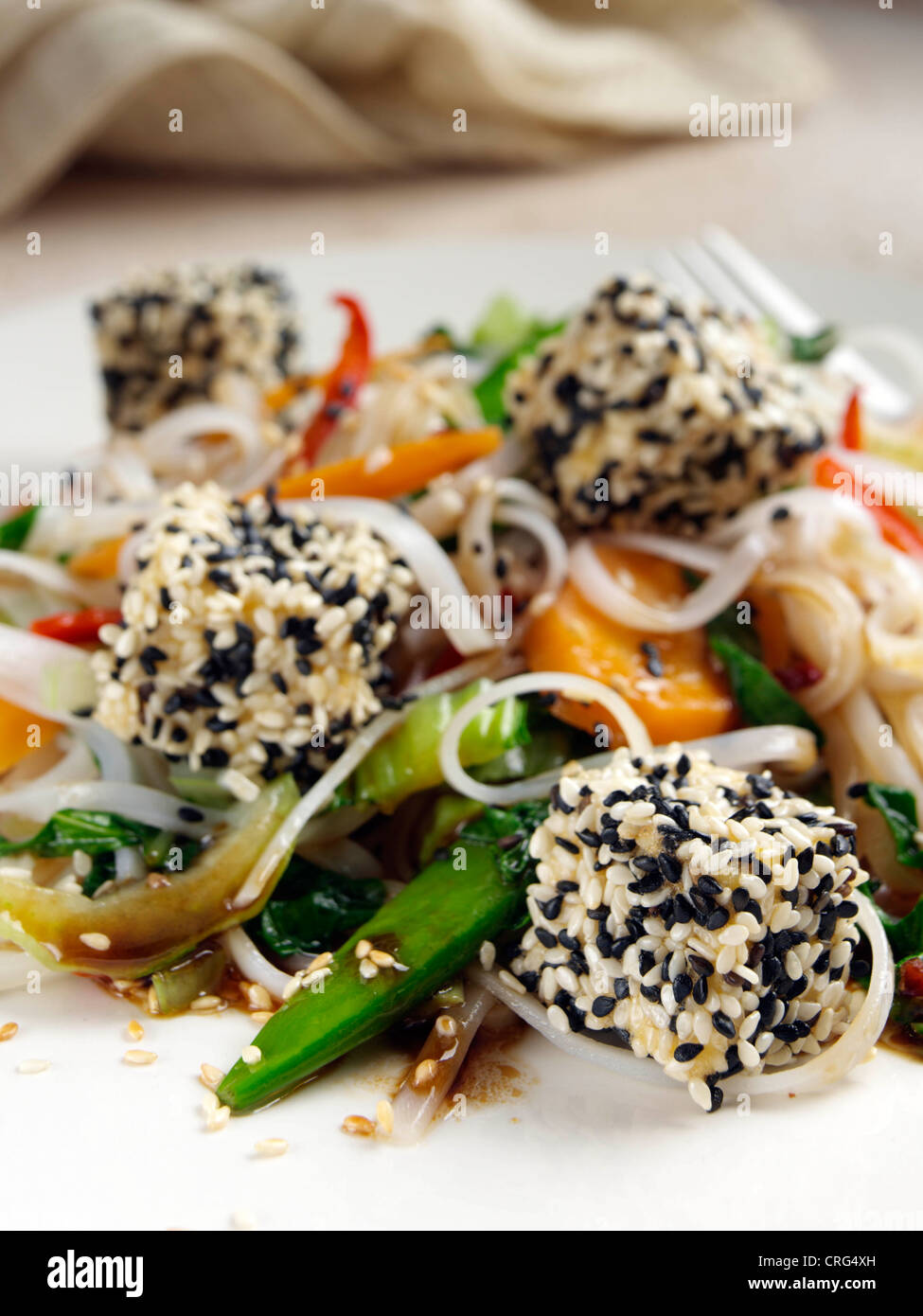 Deep fried tofu with stir fry noodles vegetables Japanese main meal