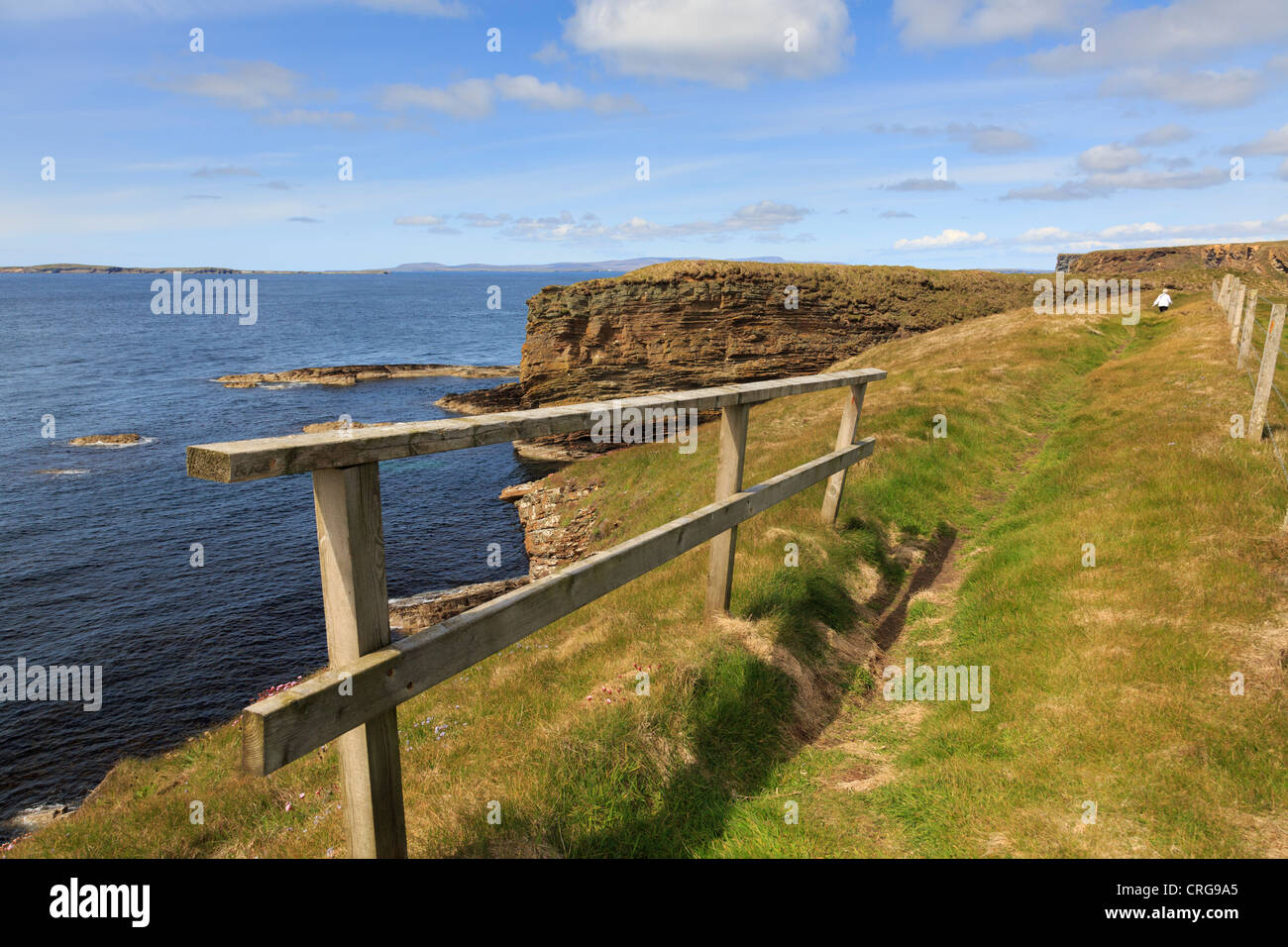 Coast path clifftop walk on seacliffs at The Wing near Burwick, South