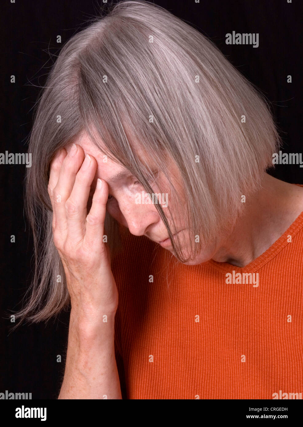 desperate elderly woman Stock Photo