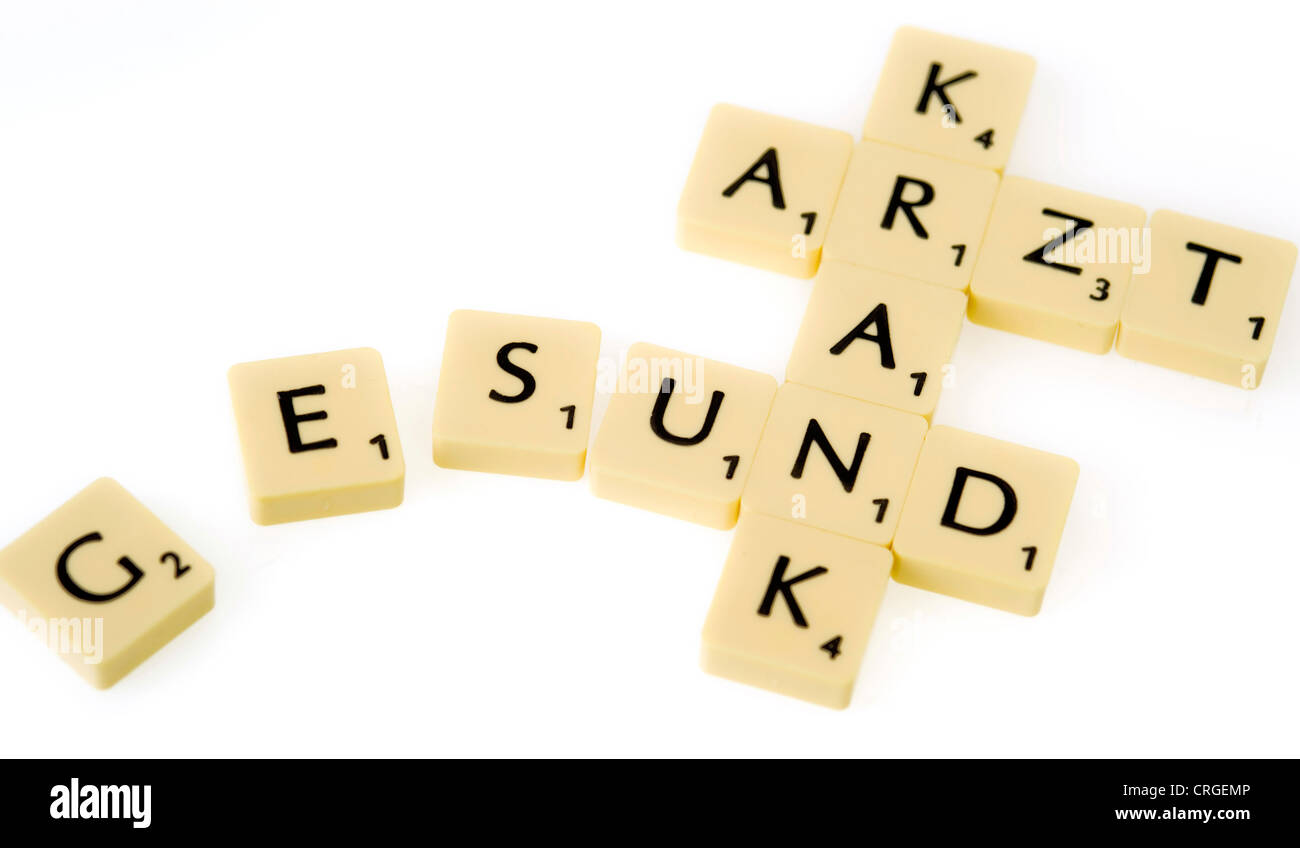 symbolic for health care Scrabble with words gesund, krank und Arzt Stock Photo Alamy