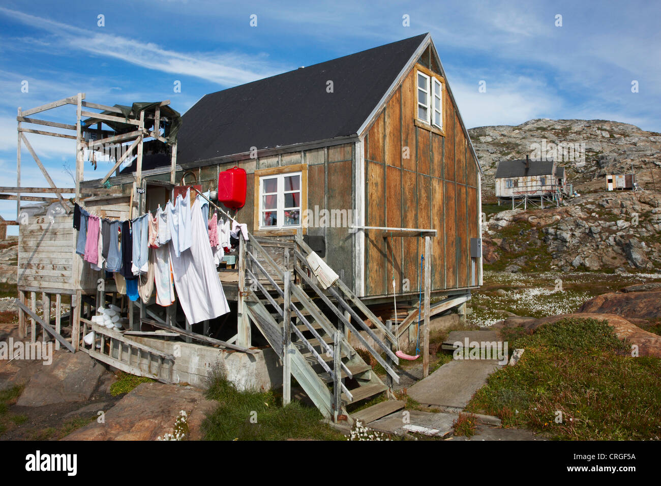 laundry drying in front of wooden house, Greenland, Ammassalik, East Greenland, Tiniteqilaq Stock Photo
