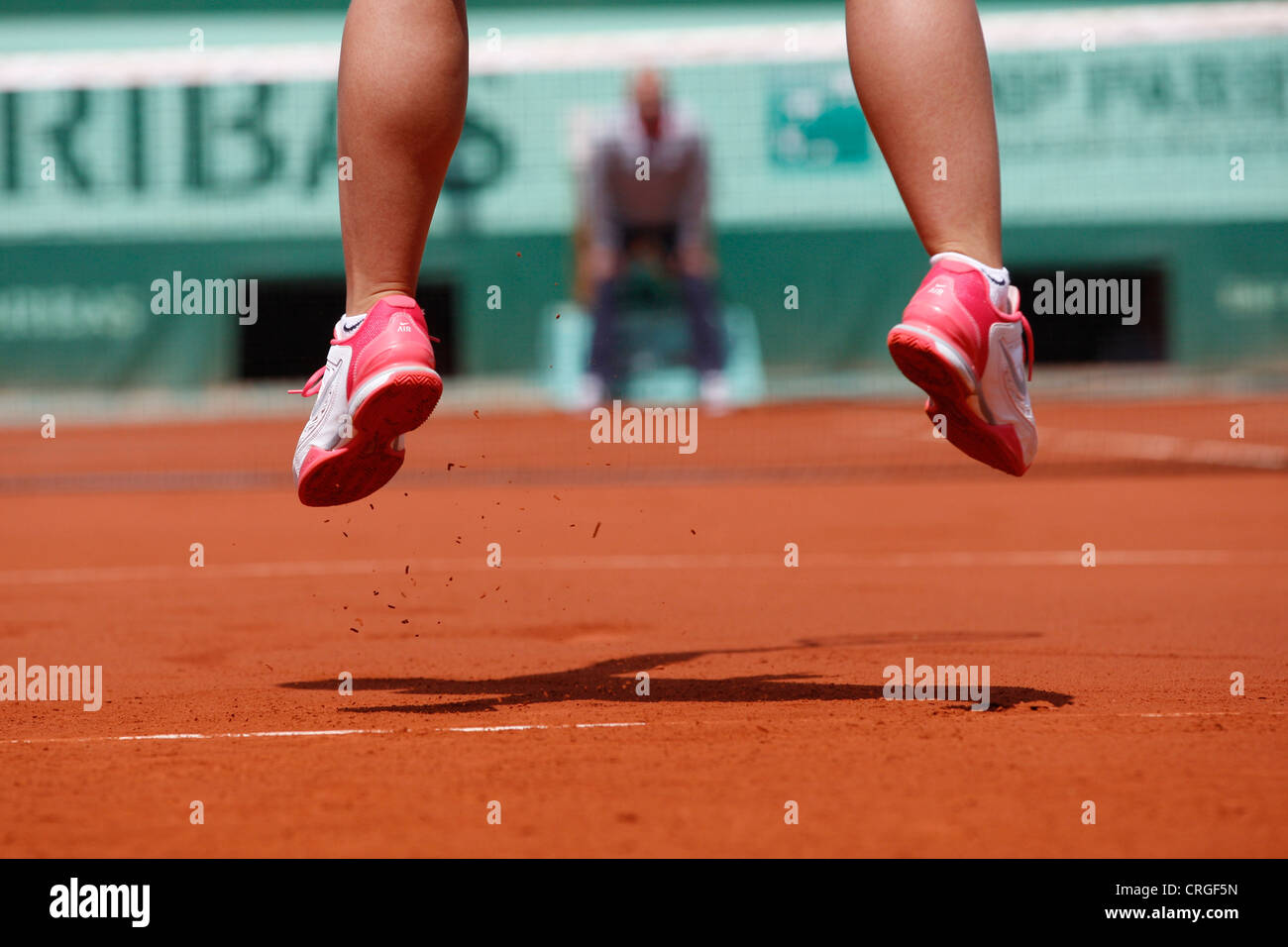 Feet of a jumping female tennis player in the air Stock Photo Alamy