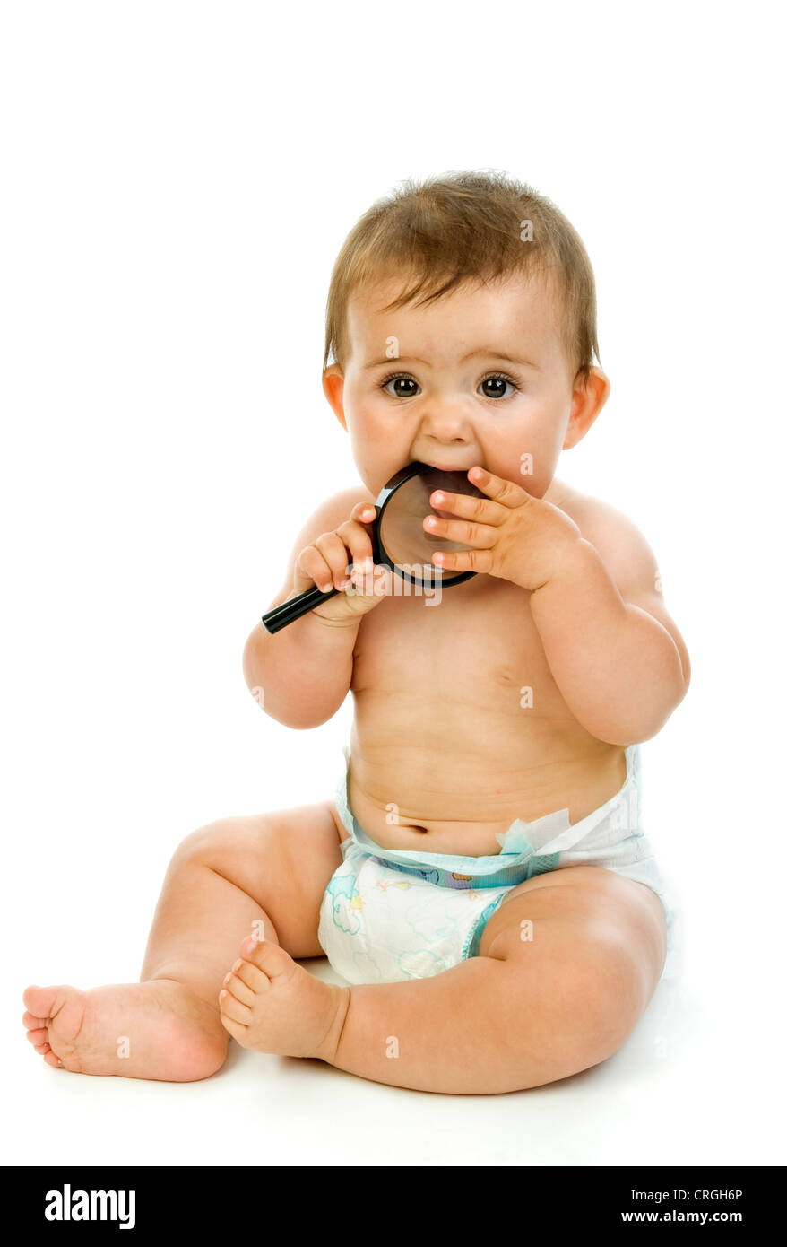 little child biting on a loupe Stock Photo