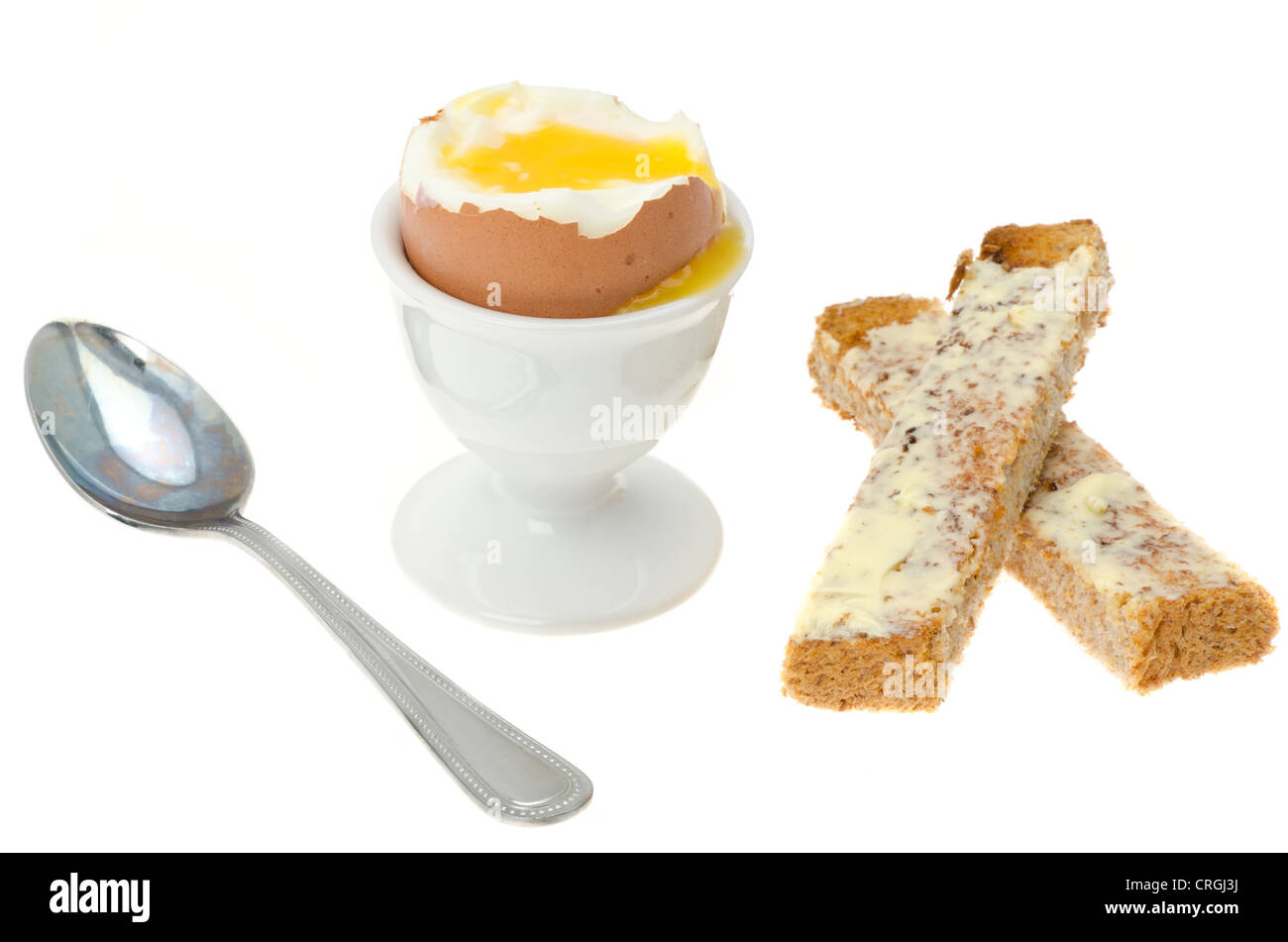 Soft boiled egg with bread fingers or soldiers - studio shot with a white background Stock Photo