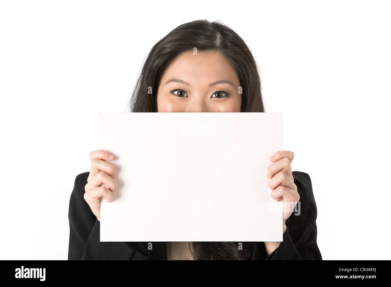 Asian Business woman looking over an empty white sign. Stock Photo