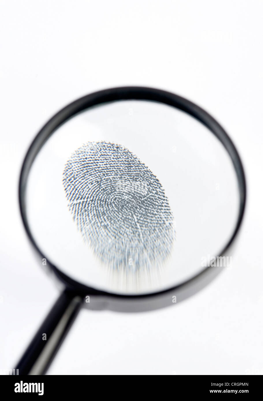 fingerprint under loupe Stock Photo