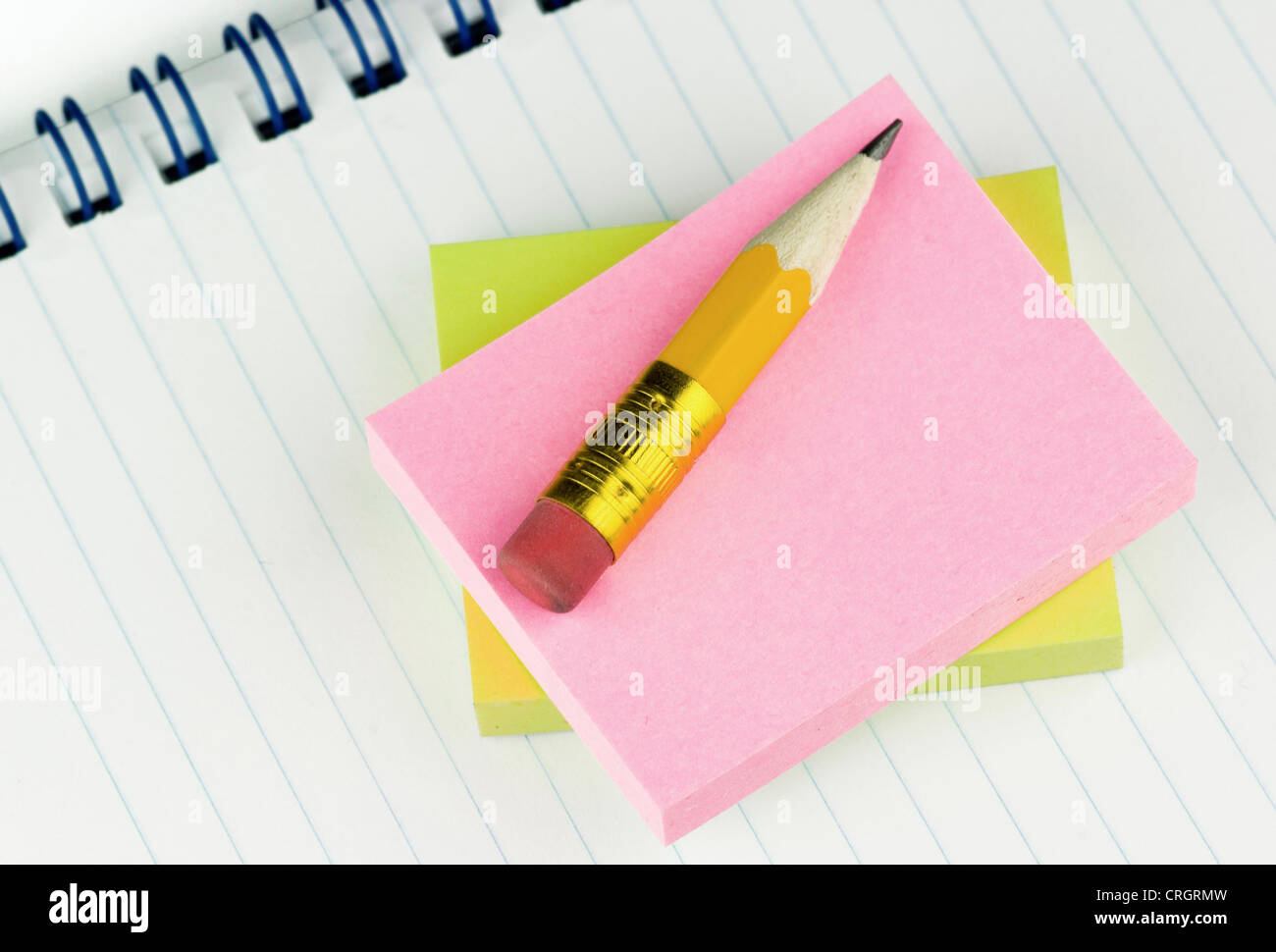 short pencil with gummed labels an notepad Stock Photo - Alamy