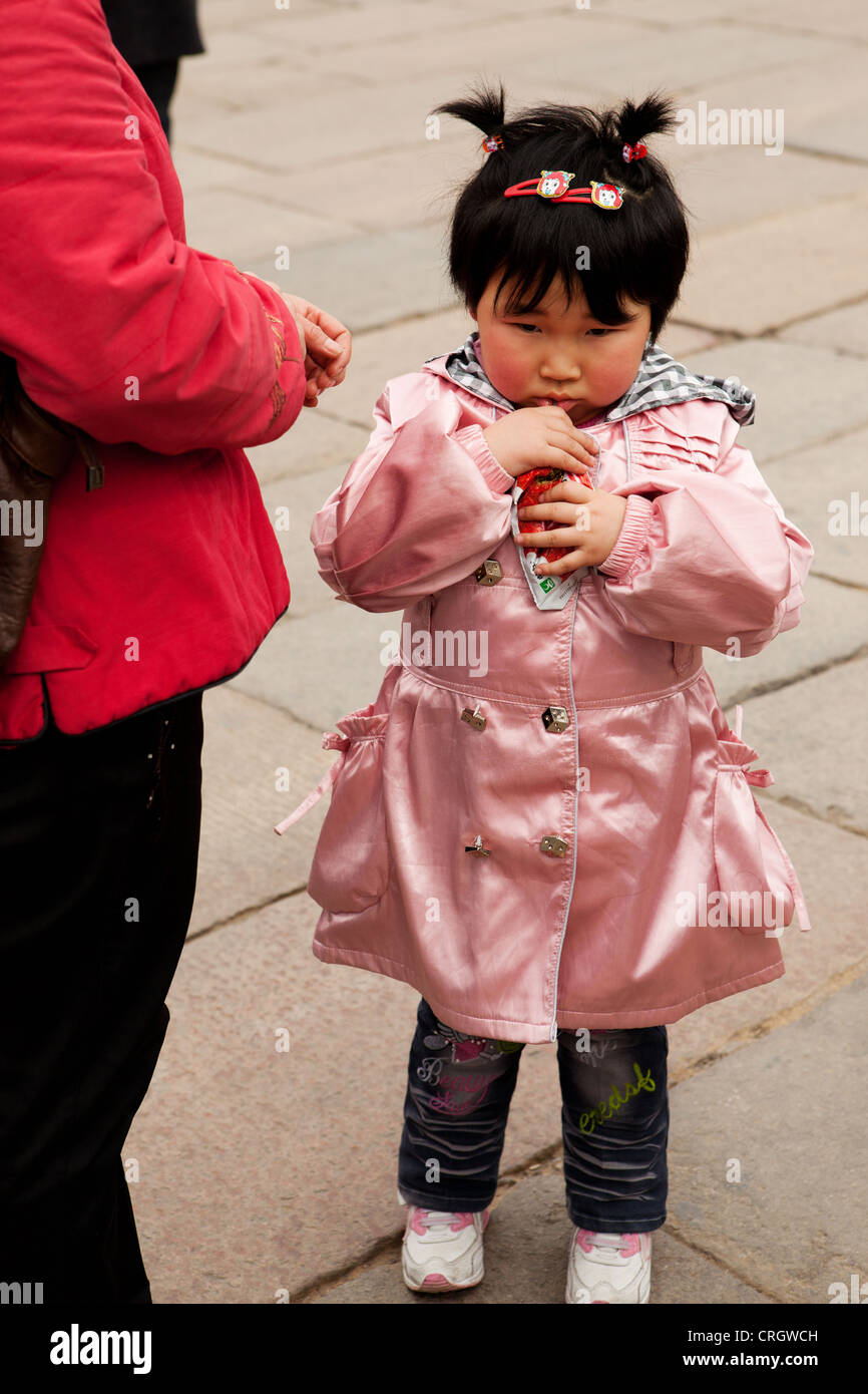 Unhappy little girl with parent at Forbidden City, Beijing, China Stock ...