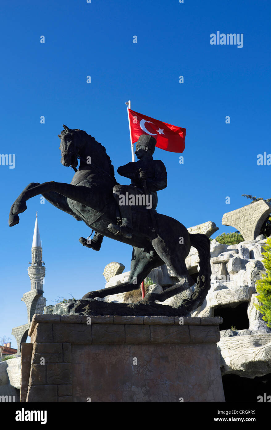 Statue of Ataturk on a horseback with the Turkish flag, in the town square, Belek, Antalya, Turkey Stock Photo