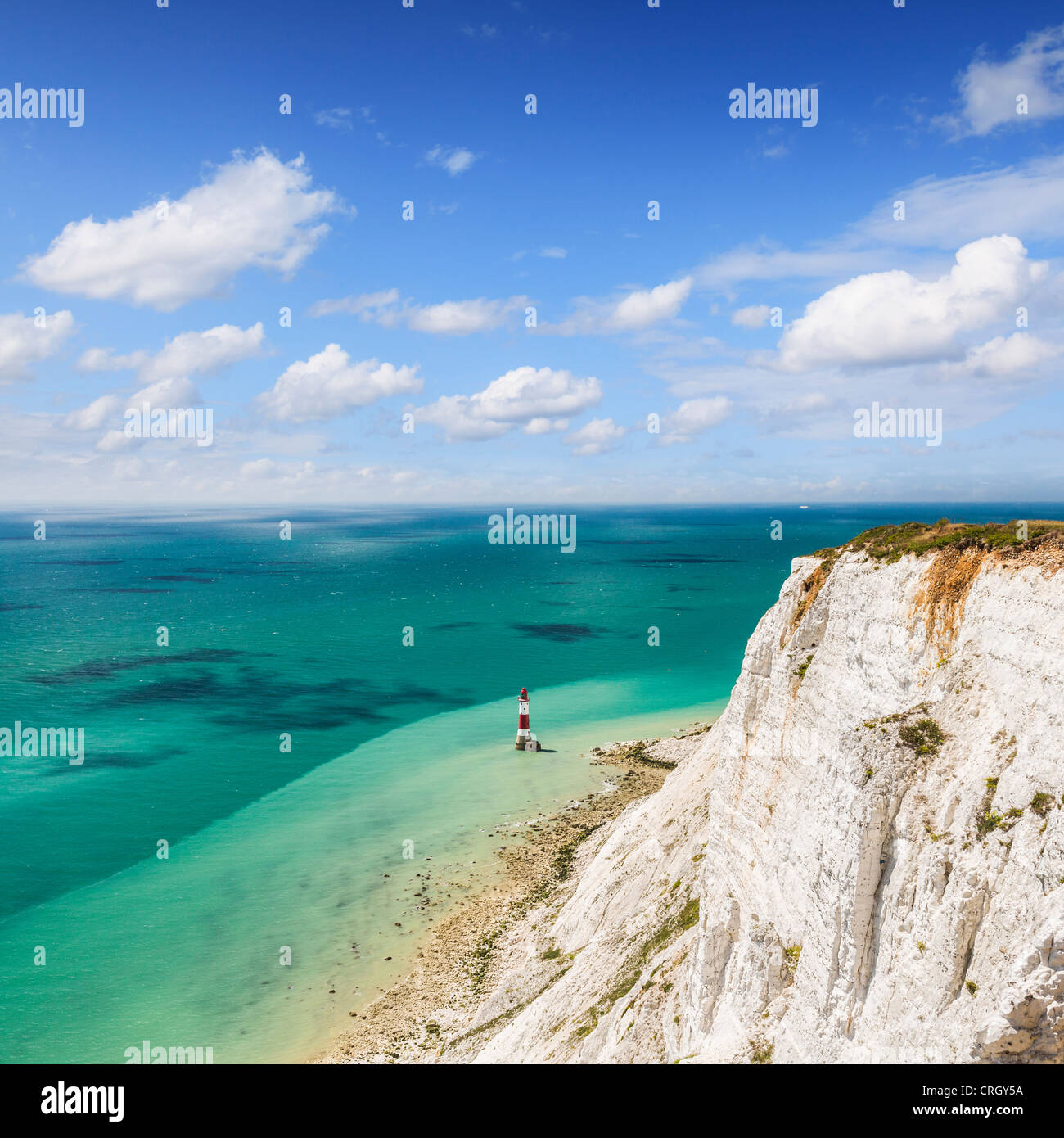 The famous red and white striped lighthouse at the foot of the chalk cliffs at Beachy Head, Sussex, England, Stock Photo