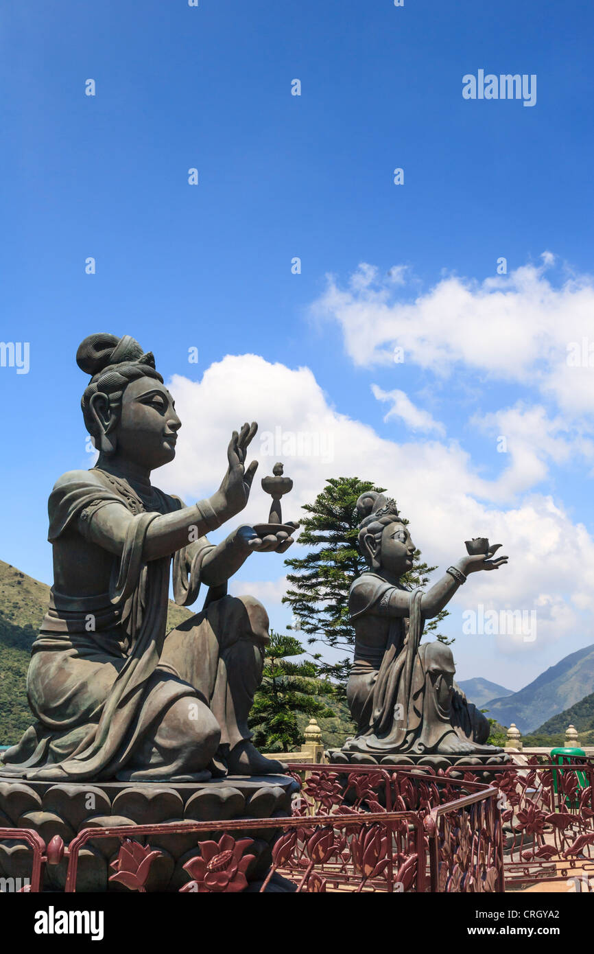 Statues of Devas making offerings at Tian Tan Buddha image on Lantau Island, Hong Kong Stock Photo