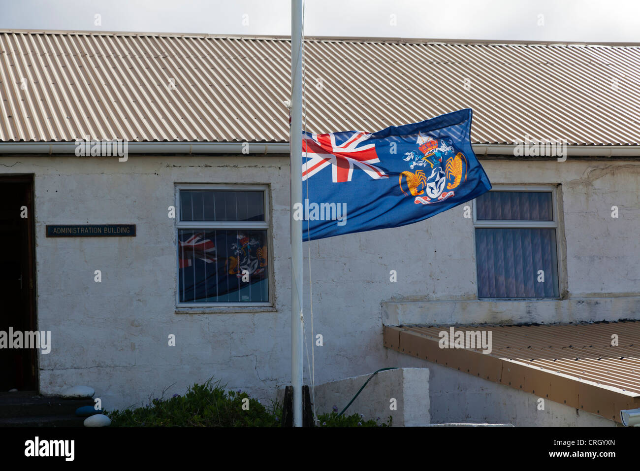 The flag of Tristan da Cunha, flying outside the Administration Office, Tristan da Cunha, South Atlantic Ocean Stock Photo