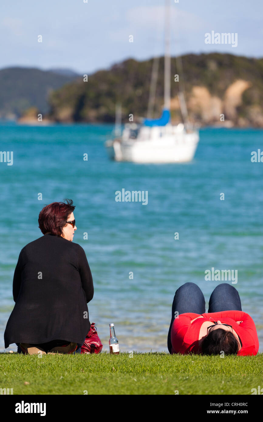 Two ladies on the shore - Bay of Islands, New Zealand 8 Stock Photo