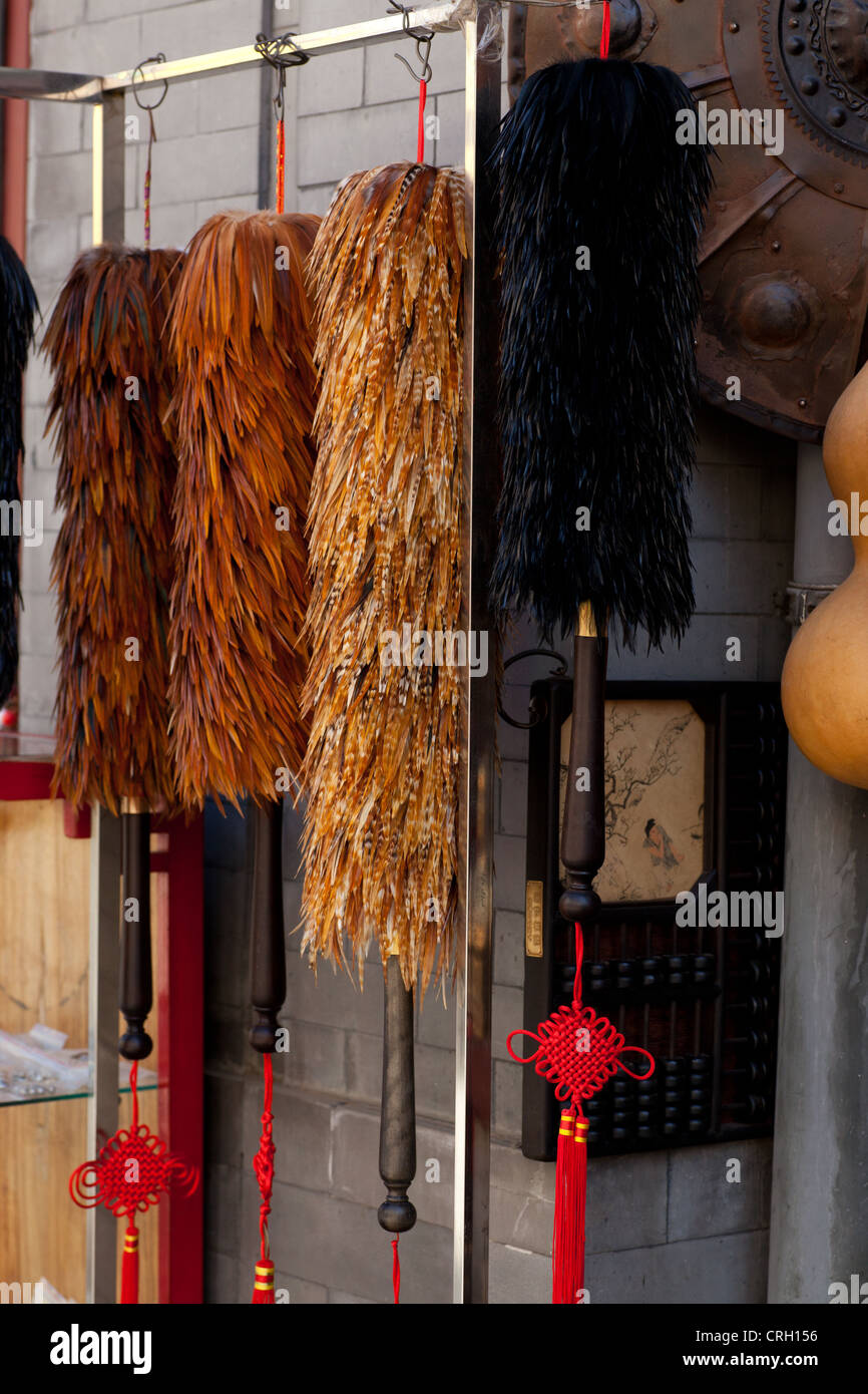 Feather dusters for sale at Panjiayuan flea market, Beijing, China