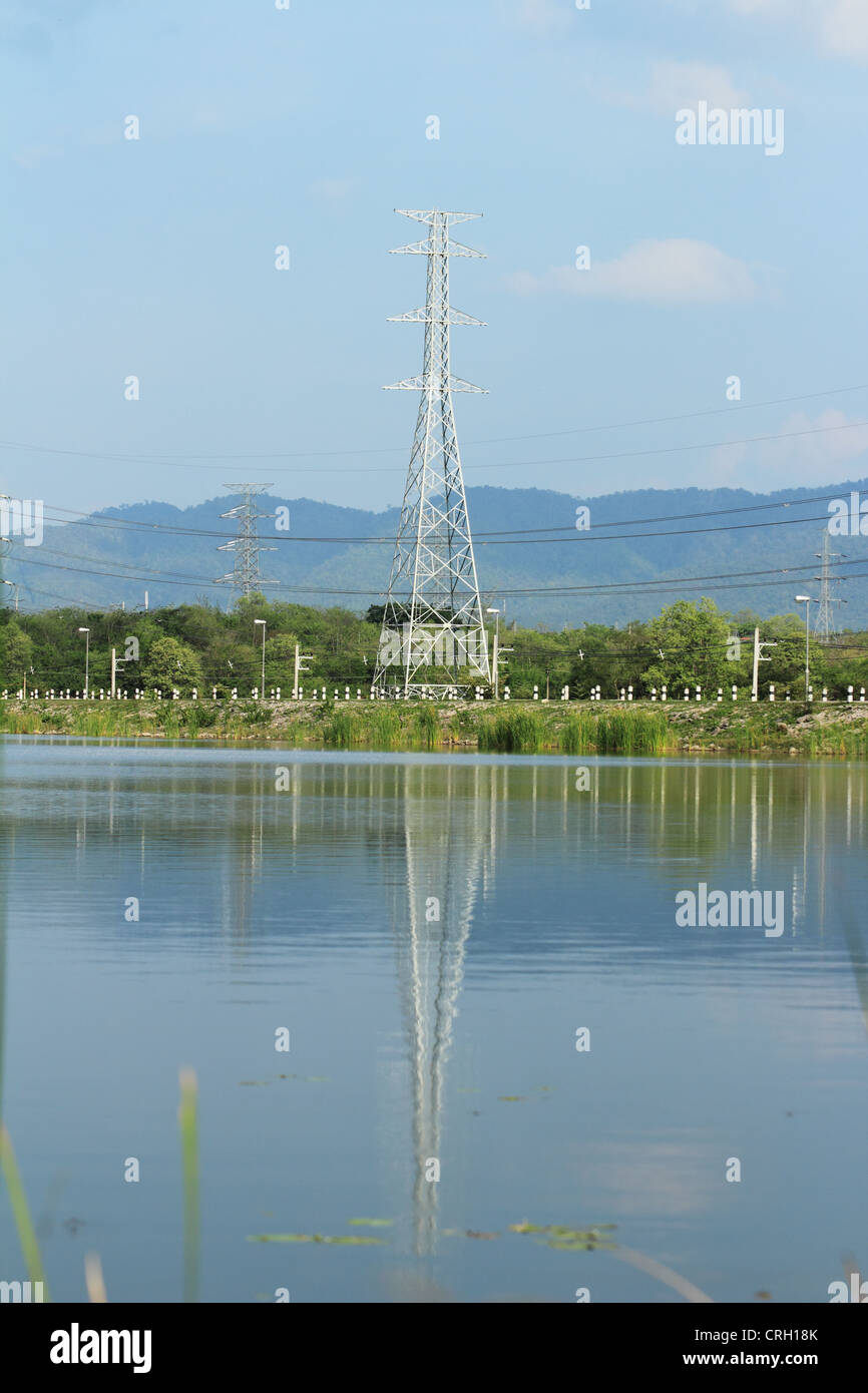Electricity pylon with reflection in water Stock Photo Alamy
