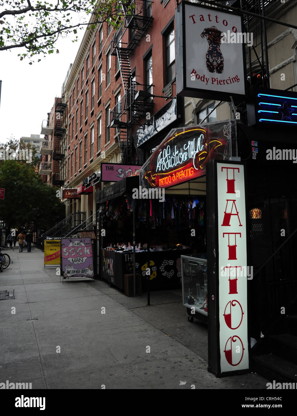 Portrait 'Addiction NYC' tattoo body piercing, 'Sock Man', 'Dangerous Clothing' stores, St.mark's Place, East Village, New York Stock Photo