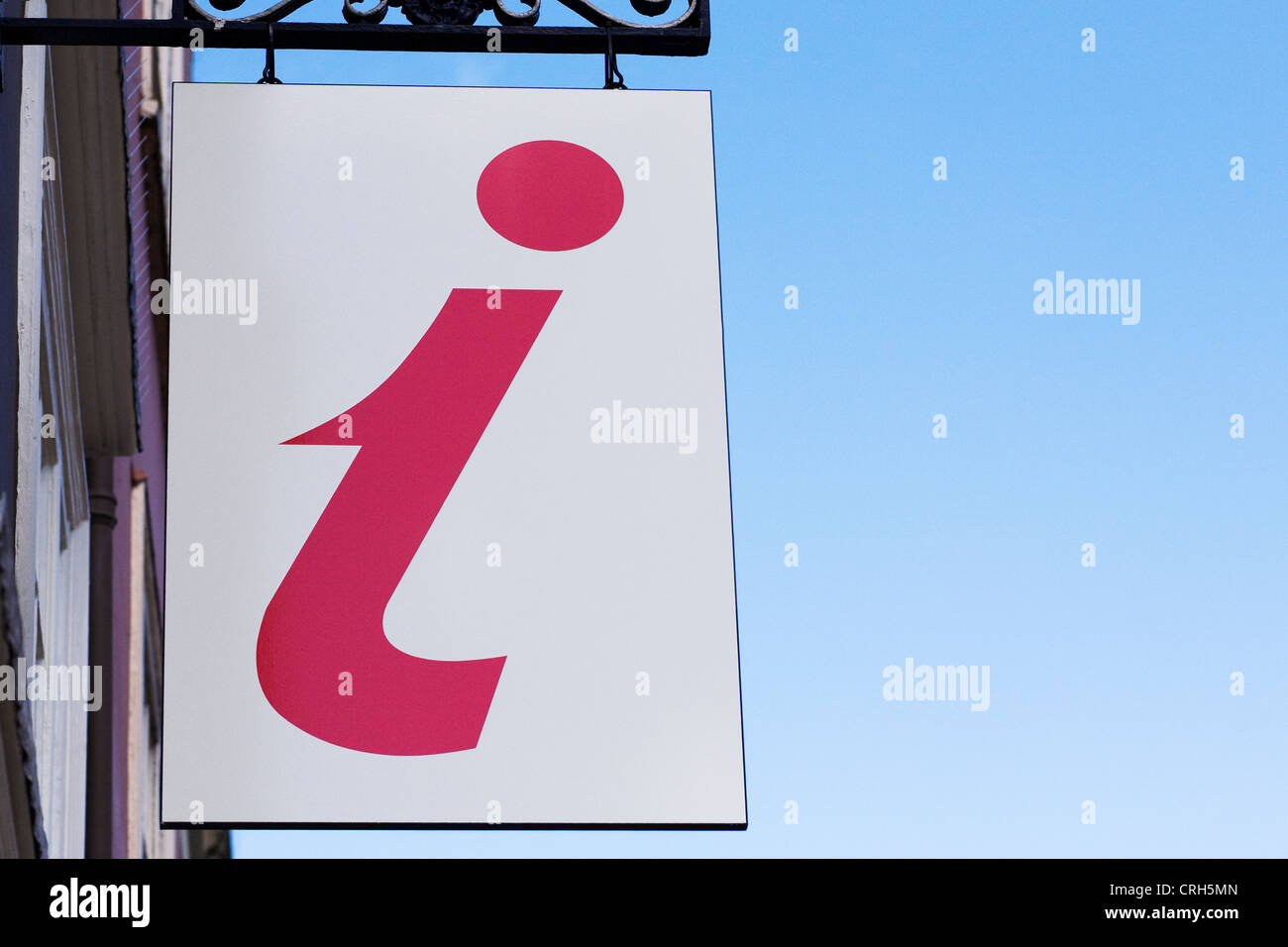 Sign at a tourist information building against a blue sky background. Stock Photo