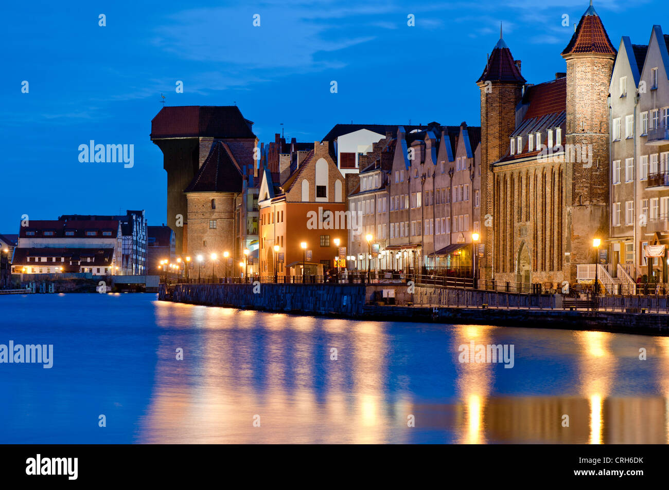 View of Old Town architecture by Motlawa River at night, Gdansk, Poland Stock Photo