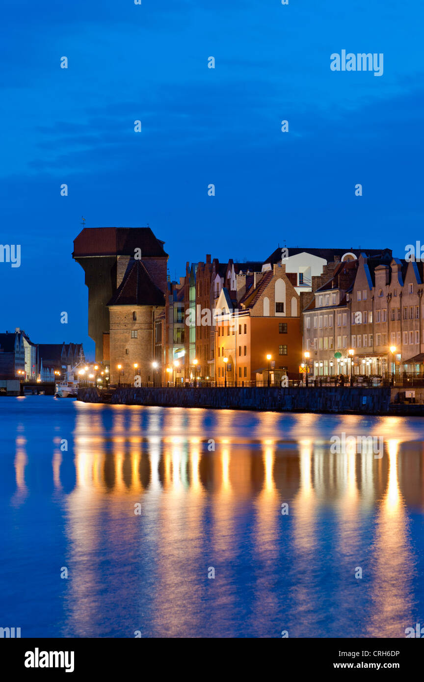 View of Old Town architecture by Motlawa River at night, Gdansk, Poland Stock Photo