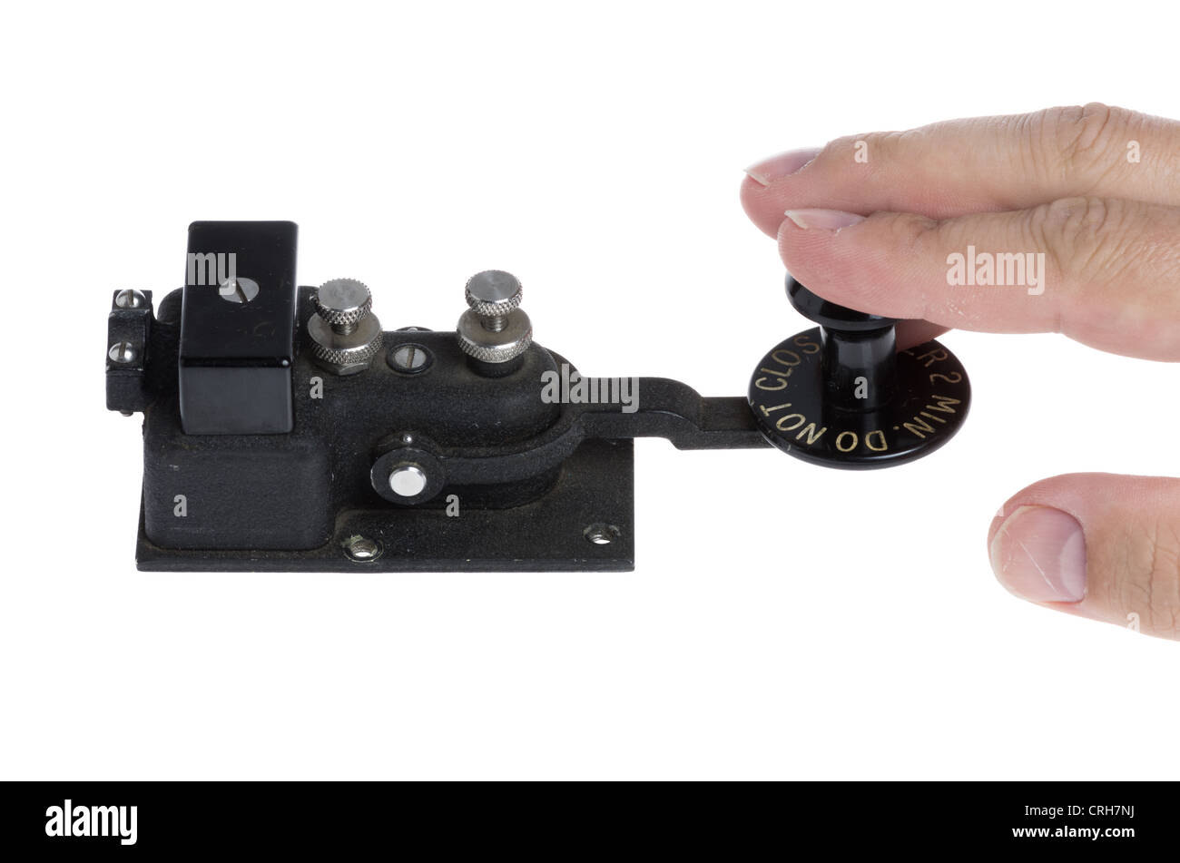 A vintage telegraph key being operated Stock Photo