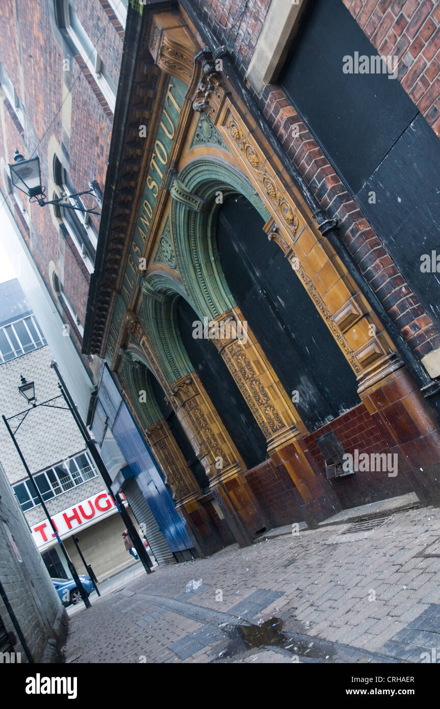 The facade of an old pub down a back alley in Sunderland, UK. The unit is now a Toymaster Stock