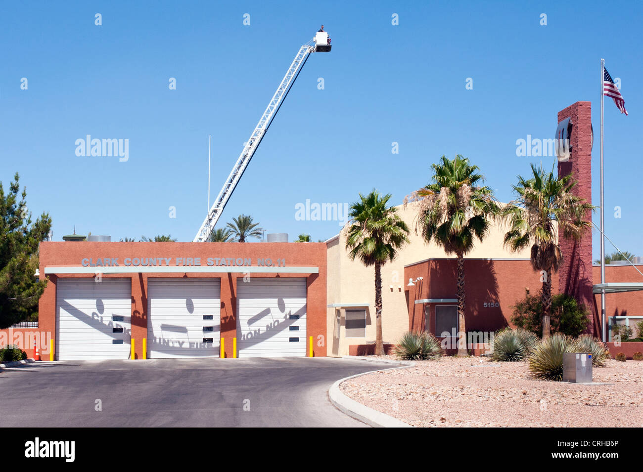 LAS VEGAS, NEVADA, USA - JUNE 17, 2012:  Exterior view of Clark County Fire Station 11 in Las Vegas with extended ladder with bucket Stock Photo