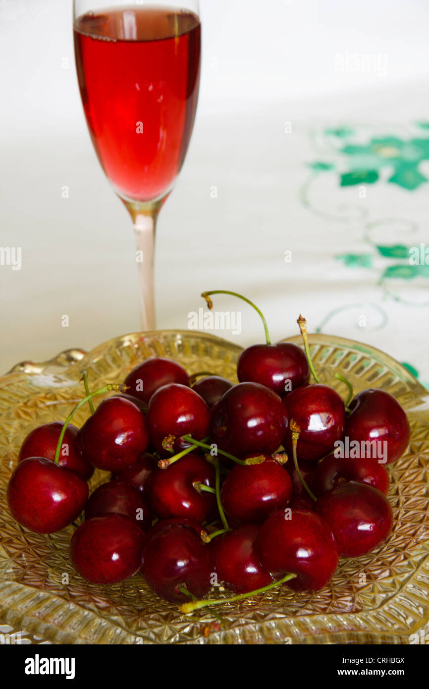 Cherries and glass of fruit juice. Stock Photo